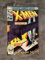 Front cover of The Uncanny X-Men #169 comic book showing dramatic artwork with X-Men characters and title text.