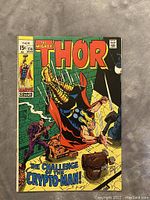Front cover of Thor comic book showing colorful action artwork and title.