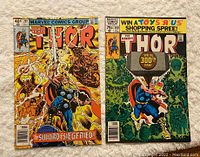 Front covers of Thor Comics #297 and #300 showing detailed action scenes typical of vintage Marvel comics with colorful, vivid art and character depiction.