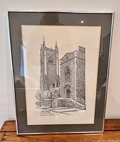 Full view of framed art showing Hart House building at University of Toronto in black and white pen and ink style