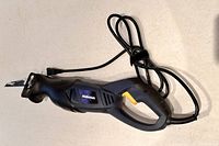 Full view of the Mastercraft reciprocating saw showing the blade and power cord coiled.