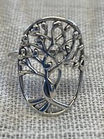 Front view of the sterling silver ring showing the intricate openwork Tree of Life design.