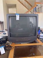 Front view of Sharp 27" CRT television showing screen and overall design.
