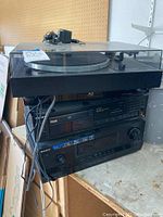 Stack of audio equipment including Thorens turntable on top, Sony Blue Ray DVD player, and Sony A/V control center at bottom