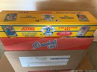 Yellow Score Collector Set box for 1990 with 714 player cards and 56 magic motion lenticular cards, showing front and sides