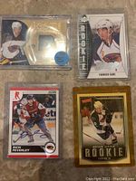 Four hockey cards featuring Atlanta Thrashers players: Braydon Coburn jersey patch card, Evander Kane rookie card, Rich Peverley signed card, Bryan Little rookie card.