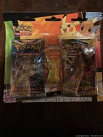 Front view of the blister pack showing Astral Radiance and Evolving Skies booster packs along with the Pikachu eraser in the center.