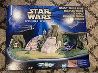 Front of sealed box showing detailed image of Naboo Temple Ruins Micro Machines playset with Star Wars Episode 1 branding.