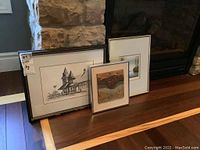 Three framed items displayed together including two prints and one framed decorative tile art.
