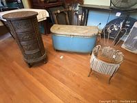 Full set of four vintage small furniture pieces showing trunk, woven cabinet, metal chair, and wicker stand