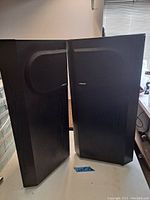Front view of both speakers standing side by side