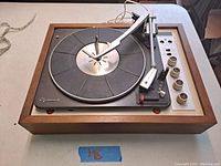 Full front view of Garrard Model 15 turntable with wooden frame and visible controls.