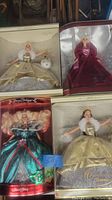 Four vintage Holiday special edition Barbies in original boxes. Three are 2000 Special Edition Celebration of the Season and one is 1995 Happy Holidays special edition.