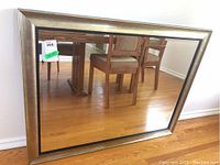 Front view of the large rectangular metallic composite framed mirror showing reflective surface and frame finish.