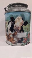 Front view showing painted cow farm scene on the tin milk can.