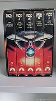 Front view of the six VHS tapes box set with titles and artwork of Starship Enterprise on spine.