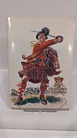 Front cover of the vintage book depicting a Highland soldier in period uniform with sword, title '78th Fighting Frasers'.