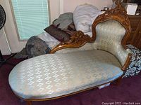 Full side view of the chaise sofa showing length and upholstery.