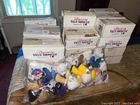 Multiple boxes labeled America's Value Showcase with bags of stuffed bears inside.