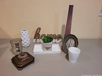 Front view of 9-piece decor set on table showing all items clearly.