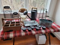 All items arranged on plaid cloth showing entire lot
