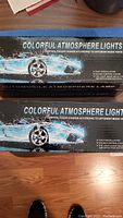 Top view of two boxes labeled 'Colorful Atmosphere Lights' showing product name and car image.