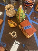 Overview photo showing all five items on a table with a lot number tag 532.