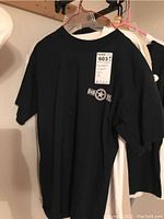 Black Bob Dylan T-shirt with a star logo and name on front, size L, worn condition