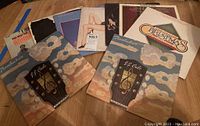 Photo showing various vinyl albums including two copies of J.J. Cale's 'Troubadour' and other albums with worn covers.