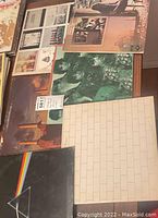 Seven Pink Floyd vinyl albums laid out, visible covers include Dark Side of the Moon, The Wall, and Animals plus four others.