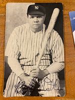 Signed Babe Ruth portrait photo on wooden table