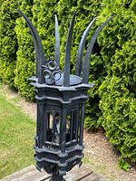 Full view at slight angle showing overall shape, hexagonal lantern and spike finials