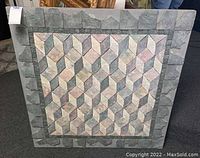 Full front view of the square wall art showing the geometric cube tile pattern and outer border tiles on wood frame
