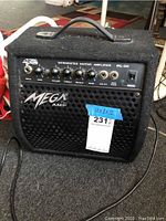 Front view of Mega DL-20 amplifier showing control panel, brand name Mega, and dimensions label 12x8x12.