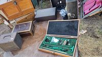 Shooter kit with brushes, rods, patches and cleaning tools in green-lined wooden box
