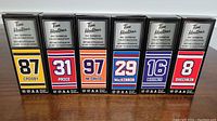 Front view of six boxed mini sticks, each box showing player's number and Tim Horton's branding