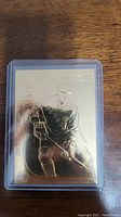 Front of 22kt gold Wayne Gretzky hockey card showing engraved image of Gretzky in Rangers uniform.