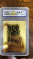Front of 1995 Skybox 23kt gold Star Trek Generations movie poster card graded WCG 10 GEM-MT in protective case.
