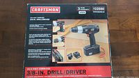 Box showing Craftsman 18-Volt Cordless 3/8-Inch Drill/Driver and included accessories.