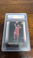 Front view of the Lebron James 2003 Upper Deck rookie card in WCG graded 10 Gem Mint case.