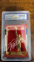 Front view of Michael Jordan 1998 Fleer 23kt Gold Red Holo Refractor basketball card enclosed in a WCG graded plastic slab with grade 10 GEM-MT.