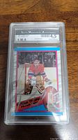 Encapsulated Patrick Roy hockey card in SMA protective case showing grading label and autograph authentication.