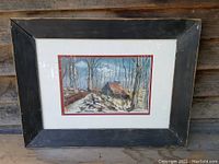 Frontal view of the framed oil painting showing the sugar shack scene and signature.