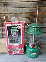 Photo of Coleman 321B Sport-Lite camp lantern next to original box showing lantern and packaging.