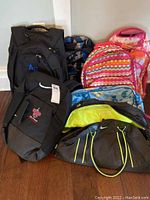 Overview of assorted bags and totes including backpacks, cooler bags and gym bags