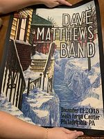 Full view of Dave Matthews Band concert poster with winter and river art, event date and location text.