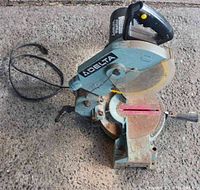 Full view of the Delta miter saw showing condition and overall design