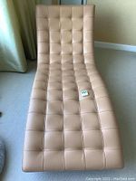Front view showing full chaise shape, tufted pattern, curvature