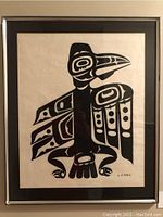 Frontal view of the entire framed print showing bird motif and frame