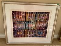 Full view of the large framed abstract optical print showing silver metal frame and white mat